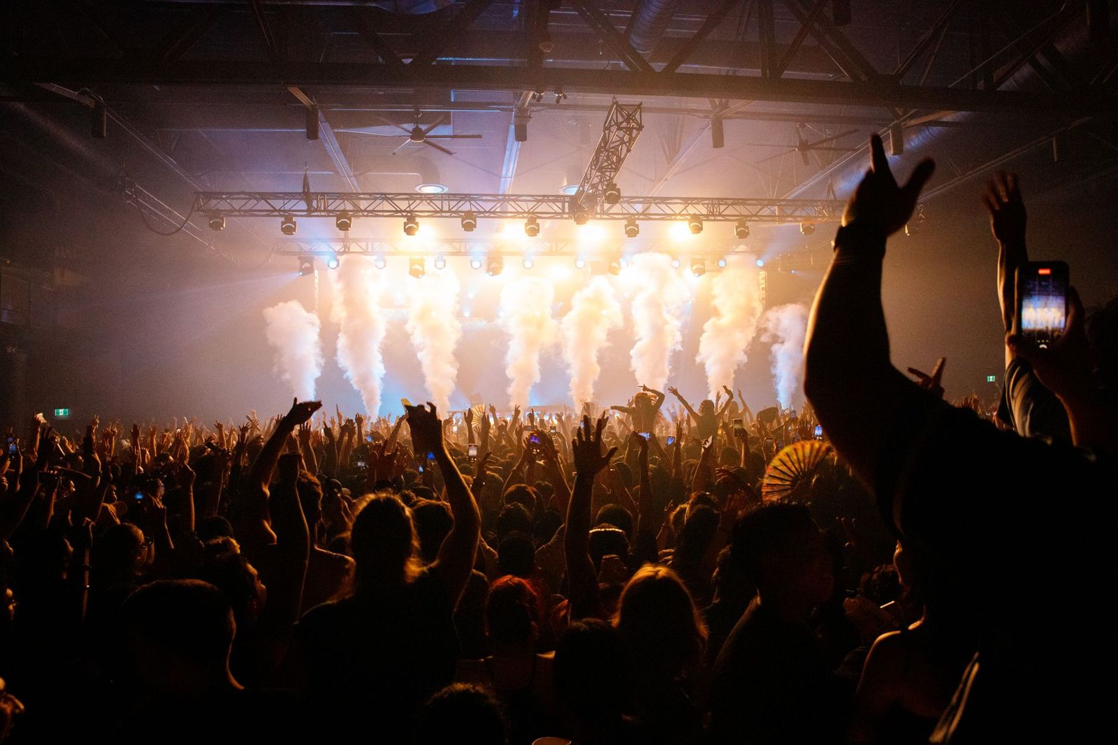 Concert crowd with hands up