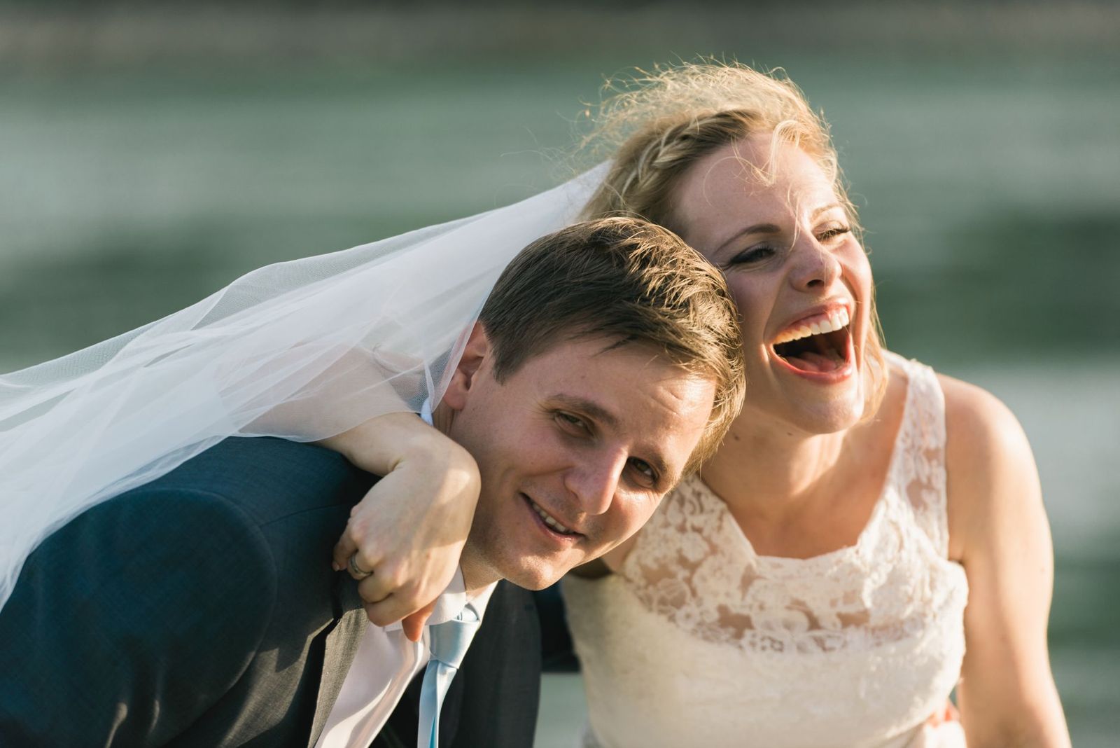 Laughing bride and groom